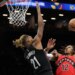 Brooklyn Nets forward Noah Clowney (21) blocks a shot by Toronto Raptors’ Collin Murray-Boyles (12) at the Barclays Center.