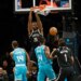 Brooklyn Nets center Day'Ron Sharpe (20) dunks during the game against the Charlotte Hornets.