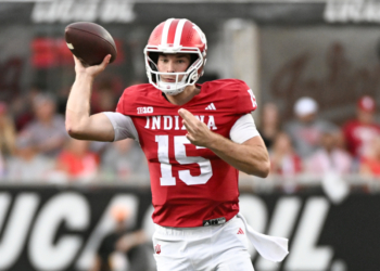 Indiana player #15 throwing a football.