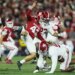 Alabama defensive lineman Tim Keenan III (96) blocks a punt by Oklahoma kicker Grayson Miller (43) during a football game.