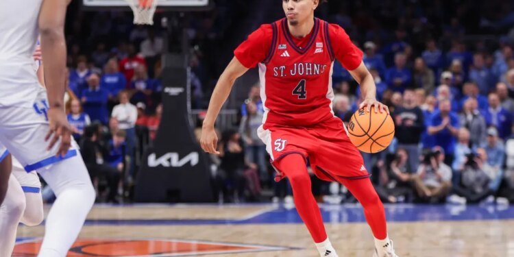 St. John Red Storm guard Oziyah Sellers (4) dribbles the ball on the court against the Kentucky Wildcats.