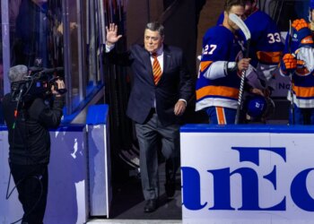 Pat LaFontaine waves to the crowd before the game.