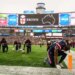 New England Patriots wide receiver Stefon Diggs (8) and teammates on the field during a tribute for the victim of the shooting at Brown University in Providence RI before the start of the game against the Buffalo Bills at Gillette Stadium.