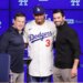 Edwin Díaz, middle, poses for photos next to General Manager Brandon Gomes, right, and President of Baseball Operations Andrew Friedman during his introduction as a new member of the Los Angeles Dodgers baseball team Friday, Dec. 12, 2025, in Los Angeles.