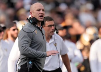 Vanderbilt head coach Clark Lea yells to an official from the sideline.