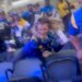 A viral video shows a blonde woman, who's sporting a Rams' Aaron Donald jersey, trying to kick someone before she falls forward and tumbles down a few rows of seats at SoFi Stadium in Inglewood, Calif. on December 14, 2024.