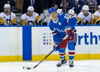Rangers defenseman Adam Fox (23) looks to pass in the first period against the Pittsburgh Penguins at Madison Square Garden, Tuesday, Oct. 7, 2025, in New York, NY.