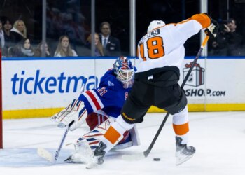 New York Rangers goaltender Igor Shesterkin defends the net against Philadelphia Flyers center Rodrigo Abols.