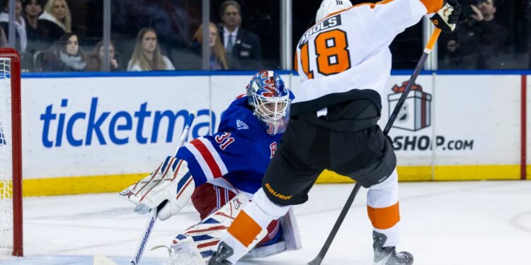 New York Rangers goaltender Igor Shesterkin defends the net against Philadelphia Flyers center Rodrigo Abols.