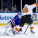 New York Rangers goaltender Igor Shesterkin defends the net against Philadelphia Flyers center Rodrigo Abols.