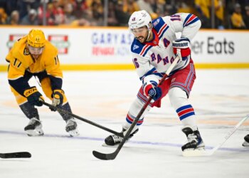 New York Rangers center Vincent Trocheck (16) skates with the puck against the Nashville Predators.