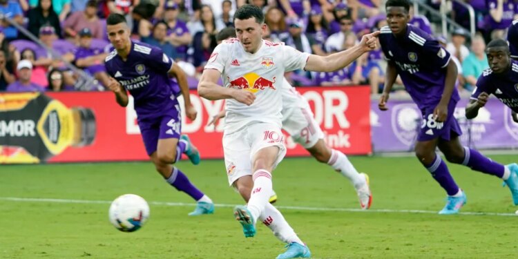 New York Red Bulls midfielder Lewis Morgan (10) scores against Orlando City on a penalty kick.