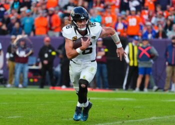Jacksonville Jaguars quarterback Trevor Lawrence runs for a touchdown against the Denver Broncos.