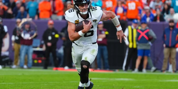 Jacksonville Jaguars quarterback Trevor Lawrence runs for a touchdown against the Denver Broncos.