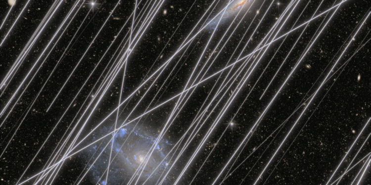 Satellites keep photobombing the Hubble telescope, and it’s getting worse