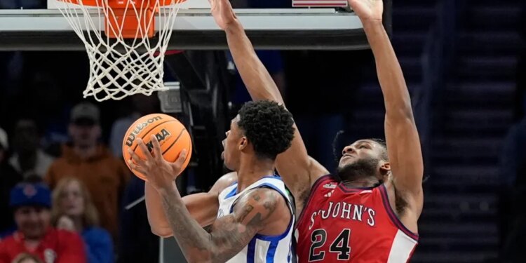 Otega Oweh looks to put up a shot as Zuby Ejiofor defends during St. John's 78-66 loss to Kentucky on Dec. 20, 2025 in Atlanta.