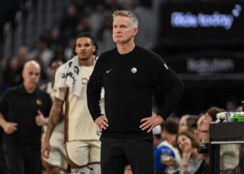 Golden State Warriors head coach Steve Kerr looking on during a game.