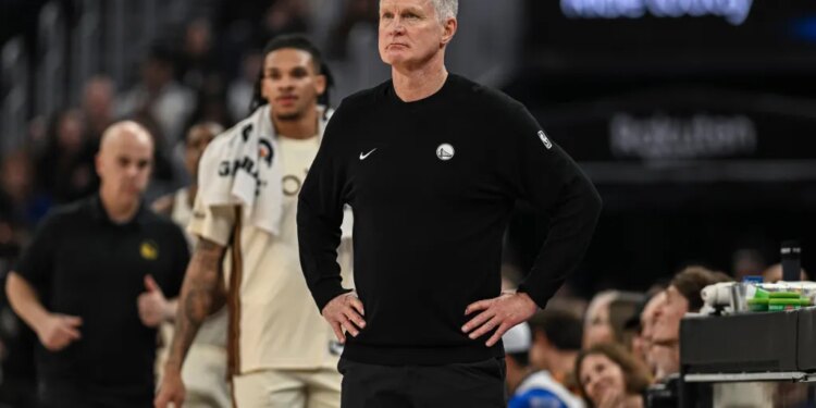 Golden State Warriors head coach Steve Kerr looking on during a game.