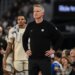 Golden State Warriors head coach Steve Kerr looking on during a game.