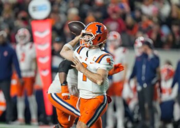 Illinois quarterback Luke Altmyer (9) looks to pass the ball against the Wisconsin during the second half of an NCAA college football game.