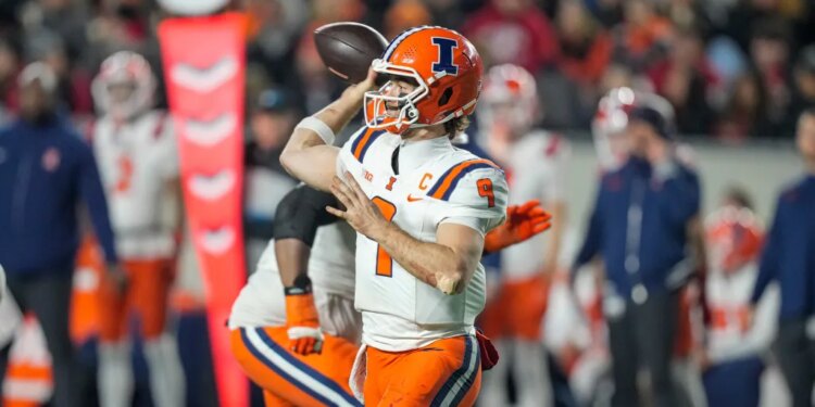 Illinois quarterback Luke Altmyer (9) looks to pass the ball against the Wisconsin during the second half of an NCAA college football game.