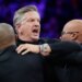 Staff restrains Minnesota Timberwolves head coach Chris Finch after a referee ejected him for chasing him down on a call for the Oklahoma City Thunder in the first quarter at Target Center.