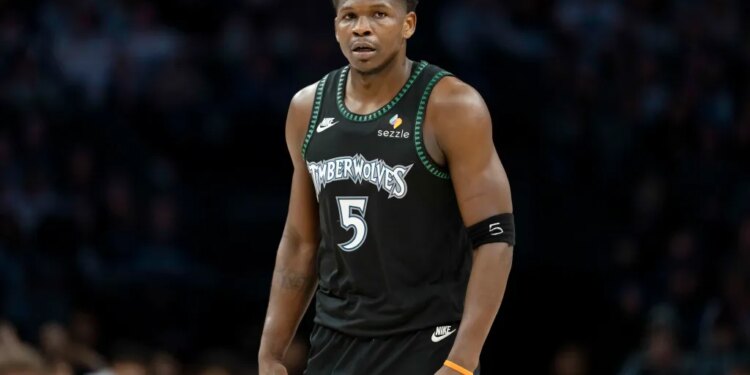 Minnesota Timberwolves guard Anthony Edwards (5) looks on against the New York Knicks.