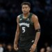 Minnesota Timberwolves guard Anthony Edwards (5) looks on against the New York Knicks.