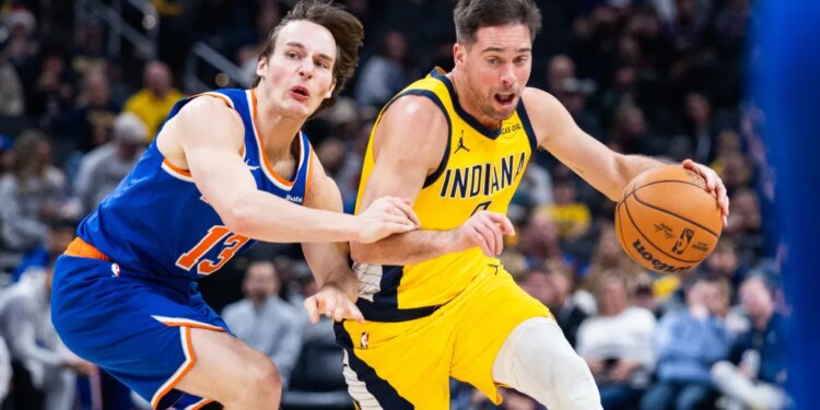 Indiana Pacers guard T.J. McConnell dribbles the ball while New York Knicks guard Tyler Kolek defends.