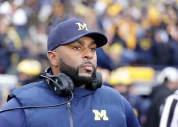 Sherrone Moore, University of Michigan Football Coach, on the sidelines.