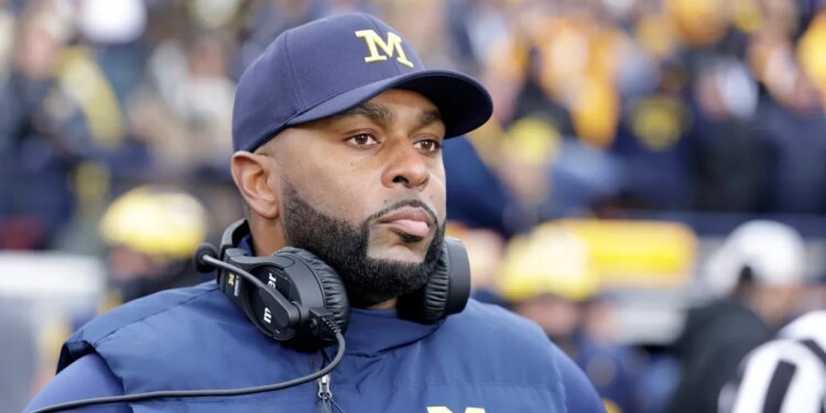 Sherrone Moore, University of Michigan Football Coach, on the sidelines.