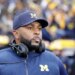 Sherrone Moore, University of Michigan Football Coach, on the sidelines.