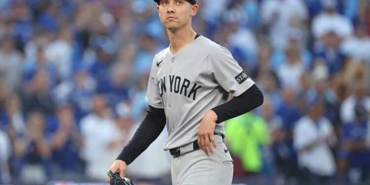 Luke Weaver #30 of the New York Yankees reacts after he is pulled from the game during the 7th inning in a game against the Blue Jays.