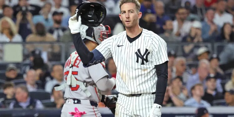New York Yankees third baseman Ryan McMahon #19 throws his helmet after he strikes out With the bases loaded ending the fifth inning.
