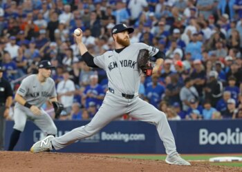 Paul Blackburn #58 of the New York Yankees throws a pitch during the 8th inning.