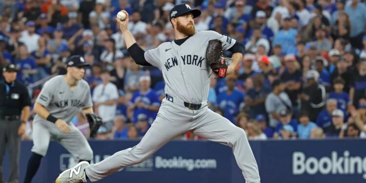 Paul Blackburn #58 of the New York Yankees throws a pitch during the 8th inning.