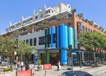 The Lululemon sportswear store in Santa Monica, California, featuring blue and green striped facade.