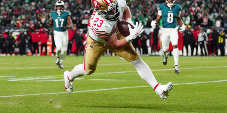 San Francisco 49ers running back Christian McCaffrey scoring a touchdown against the Philadelphia Eagles.