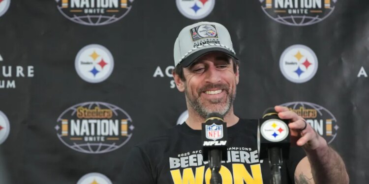 Pittsburgh Steelers quarterback Aaron Rodgers smiles while speaking during a news conference.