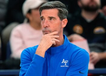 Air Force basketball coach Joe Scott watches a game.