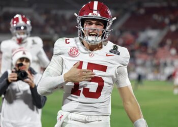 Alabama quarterback Ty Simpson (15) celebrates winning after the first round of an NCAA College Football Playoff against Oklahoma, Friday, Dec. 19, 2025, in Norman, Okla.
