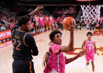 Alijah Arenas, son of former NBA great Gilbert Arenas, goes up for a layup during his college debut for USC in a 74-68 home loss to Northwestern.