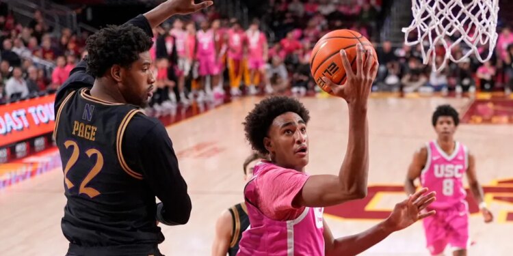Alijah Arenas, son of former NBA great Gilbert Arenas, goes up for a layup during his college debut for USC in a 74-68 home loss to Northwestern.