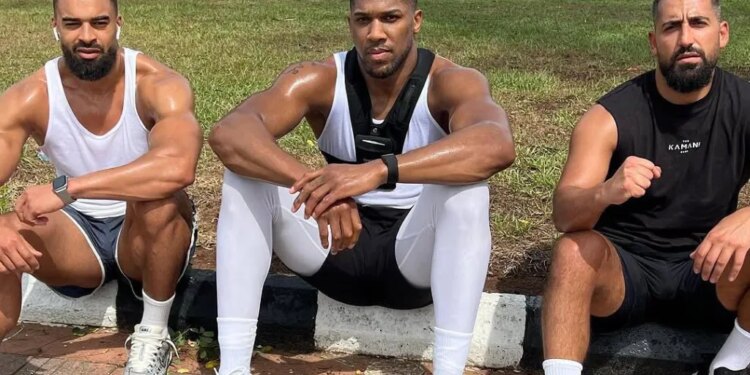 Anthony Joshua and his two friends, Sina Ghami and Latif Ayodele, posing after a workout.