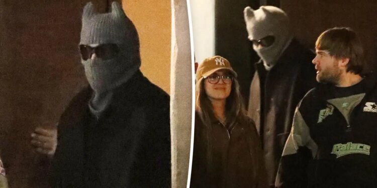 Bad Bunny seen in public with head covering in Los Angeles
