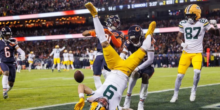 Chicago Bears cornerback Nahshon Wright (26) helps takes down Green Bay Packers wide receiver Christian Watson (9), who fumbles the ball just short of the end zone on Jan. 10, 2026.
