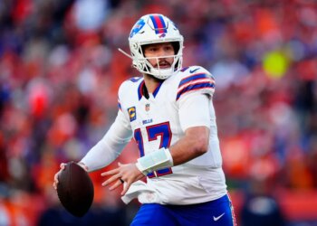 Buffalo Bills quarterback Josh Allen (17) rolls out during a game against the Denver Broncos.