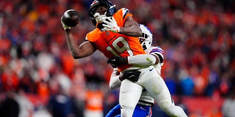 Bills cornerback Tre'davious White (27) is called for a pass interference on Broncos wide receiver Marvin Mims Jr. (19) during overtime on Jan. 17, 2026.