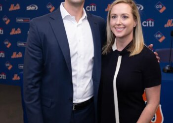 David Stearns, the new President of Baseball Operations for the New York Mets, poses with his wife, Whitney, at a press conference.