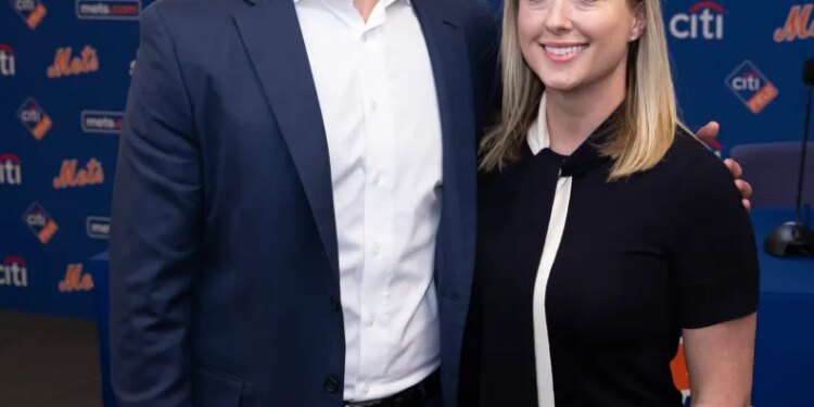 David Stearns, the new President of Baseball Operations for the New York Mets, poses with his wife, Whitney, at a press conference.